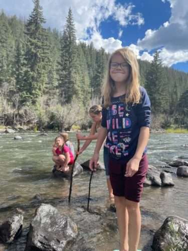 PPOS fourth-grader Jayelle plays in the Rio Grande during her class camping trip.
