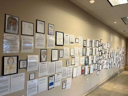 A wall displaying all the writing work PPOS students did for Showcase Night