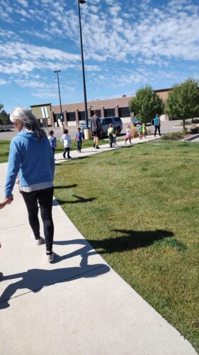 Pagosa Peak Open School kindergartners walking single file to Walmart