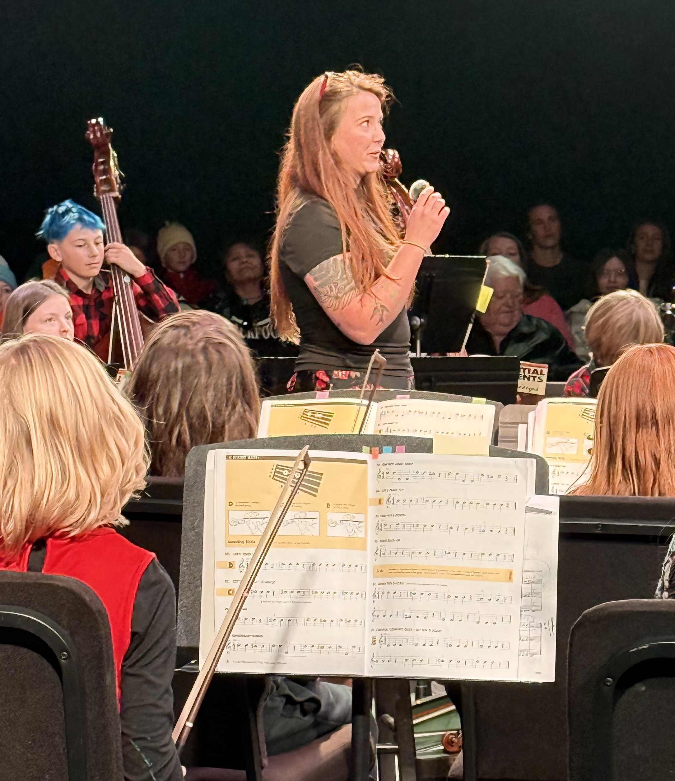 A PPOS student working on an art project with construction paper.