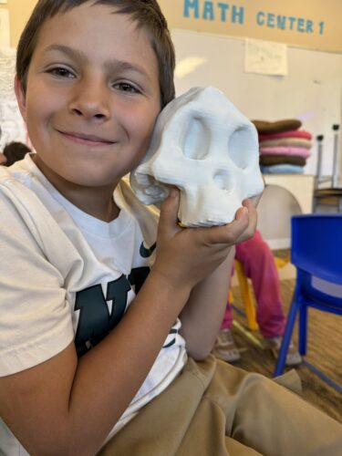 Second-grader Remi shows us the 3D printed skull of Lucy, the famous Australopithecus afarensis fossil discovered in Ethiopia.